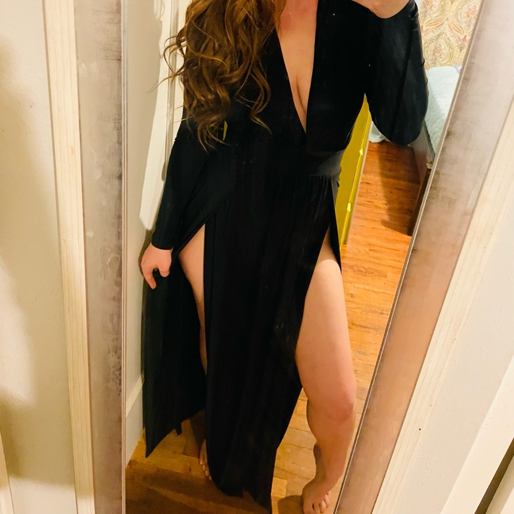 This is a black dress with slits down both sides